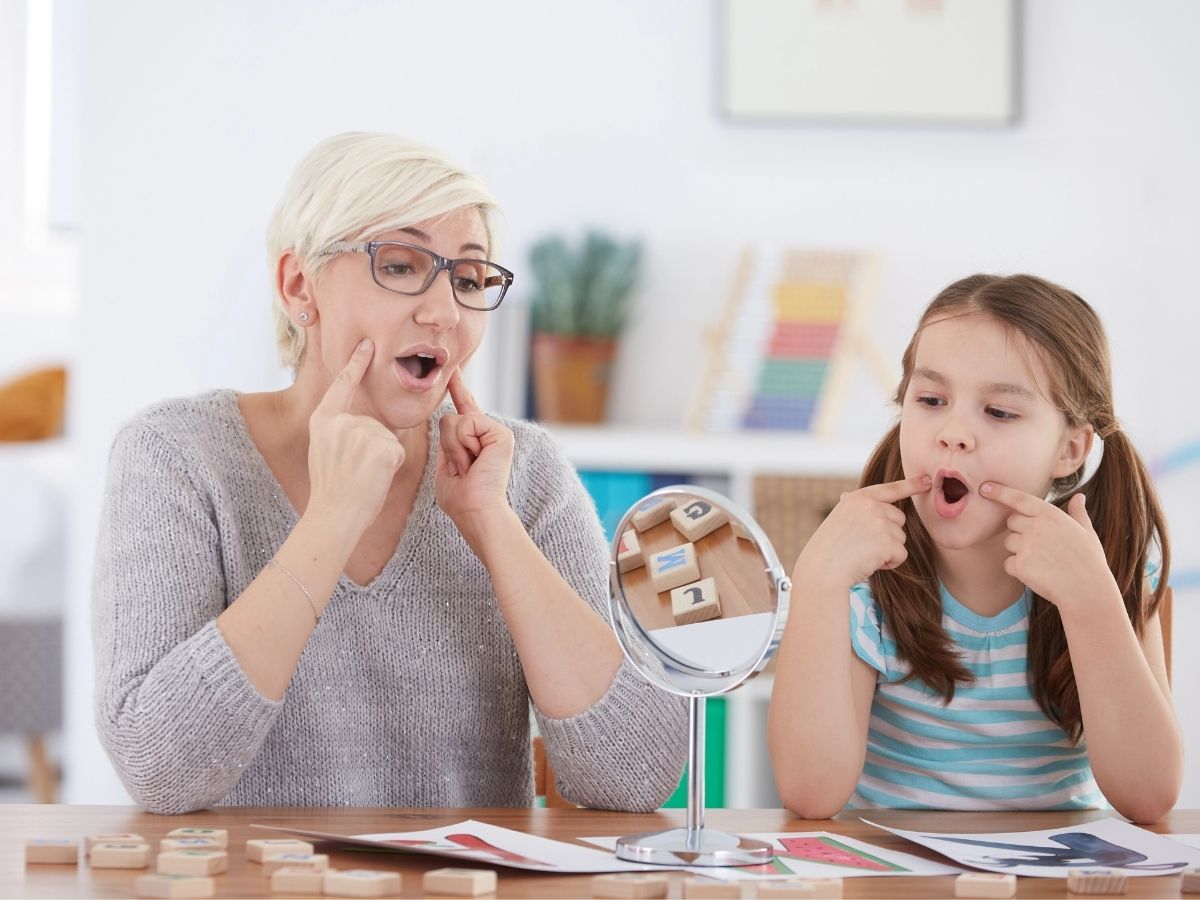 An experienced SLP working with a student